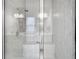 Modern glass-enclosed shower boasts sleek fixtures and a convenient built-in bench at 3493 Lazy River Ter, Sanford, FL 32771