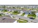 Neighborhood street view featuring well-manicured lawns, diverse home styles, and a glimpse of nearby community amenities at 3493 Lazy River Ter, Sanford, FL 32771