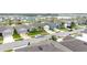 Scenic street view with diverse, colorful homes, well-kept lawns, and parked cars in a vibrant community setting at 3493 Lazy River Ter, Sanford, FL 32771