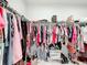 Walk-in closet featuring organized clothing racks and ample storage space at 3493 Lazy River Ter, Sanford, FL 32771