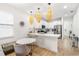 Modern kitchen featuring stainless steel appliances, hardwood floors, and white cabinets at 350 E 2Nd Ave, New Smyrna Beach, FL 32169