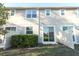 Exterior townhouse backyard with a sliding glass door and partial fence at 3557 Brighton Park Cir, Orlando, FL 32812