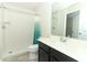 Bathroom featuring a walk-in shower, toilet, and single sink vanity at 3557 Brighton Park Cir, Orlando, FL 32812