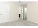 Neutral carpet in bedroom featuring two open doors at 3557 Brighton Park Cir, Orlando, FL 32812
