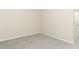 Empty carpeted bedroom with neutral walls, white trim, and natural light at 3557 Brighton Park Cir, Orlando, FL 32812