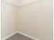 Walk in closet with carpet and white wire shelving racks at 3557 Brighton Park Cir, Orlando, FL 32812