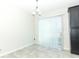 Dining Area featuring tile flooring, slider leading to back patio, and dark stained cabinets at 3557 Brighton Park Cir, Orlando, FL 32812