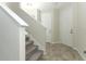 Inviting entryway featuring a carpeted staircase and tile flooring leading to other rooms at 3557 Brighton Park Cir, Orlando, FL 32812