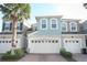 Beautiful townhome with a two-car garage, manicured landscaping, and a neutral color palette at 3557 Brighton Park Cir, Orlando, FL 32812