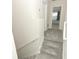 Cozy hallway with carpeted stairs leading to the upper level, offering comfort and style at 3557 Brighton Park Cir, Orlando, FL 32812