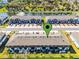 Aerial view of townhome community with a nearby lake and fountain, ample parking available at 385 Cape Honeysuckle Pl, Sanford, FL 32771