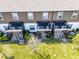 Aerial view of fenced back patios with outdoor seating and air conditioning units at 385 Cape Honeysuckle Pl, Sanford, FL 32771