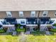 Aerial view of fenced back patios with outdoor seating and air conditioning units at 385 Cape Honeysuckle Pl, Sanford, FL 32771