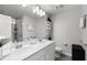 Modern bathroom with a double sink vanity and glass-enclosed shower at 385 Cape Honeysuckle Pl, Sanford, FL 32771
