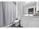 Well-lit bathroom with a double vanity and modern fixtures at 385 Cape Honeysuckle Pl, Sanford, FL 32771