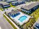 Aerial view of a community pool with lounge chairs and a covered pavilion at 385 Cape Honeysuckle Pl, Sanford, FL 32771