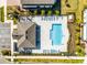 Aerial view of community pool and pavilion, surrounded by lounge chairs and lush landscaping at 385 Cape Honeysuckle Pl, Sanford, FL 32771