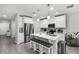 Modern kitchen with a center island and breakfast bar seating at 385 Cape Honeysuckle Pl, Sanford, FL 32771