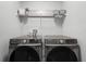 Well-equipped laundry room with modern washer and dryer set at 385 Cape Honeysuckle Pl, Sanford, FL 32771