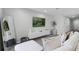 Modern living room with a large-screen TV and neutral decor at 385 Cape Honeysuckle Pl, Sanford, FL 32771
