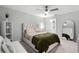 Spacious main bedroom with a plush bed and elegant furnishings at 385 Cape Honeysuckle Pl, Sanford, FL 32771