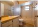 Functional bathroom featuring a vanity with good lighting, tiled floors, and a shower-tub combo, designed for convenience at 385 Eron Way # 45, Winter Garden, FL 34787