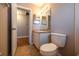 Clean bathroom with tiled floors, a vanity with good lighting, and a toilet, designed for practicality at 385 Eron Way # 45, Winter Garden, FL 34787