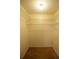 Walk-in closet with ample shelving and carpet, offering plenty of storage space in a neat arrangement at 385 Eron Way # 45, Winter Garden, FL 34787