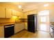 Bright kitchen with tiled floors, wooden countertops, and opening into living space at 385 Eron Way # 45, Winter Garden, FL 34787