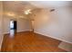 Spacious living room featuring vaulted ceiling, ceiling fan, wood-look flooring, and recessed lighting at 385 Eron Way # 45, Winter Garden, FL 34787