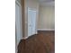 Spacious room features laminate floor, a double-door closet and white doors at 404 Summit Ridge Pl # 212, Longwood, FL 32779