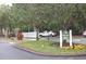 Well maintained entrance to the community with flowers and landscaping at 404 Summit Ridge Pl # 212, Longwood, FL 32779