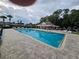 Community pool with lounge chairs at 4151 Forest Island Dr, Orlando, FL 32826