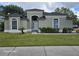 Beautiful single-story home with lush green lawn and lovely landscaping at 4151 Forest Island Dr, Orlando, FL 32826