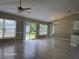 Bright living room with large windows and sliding glass doors at 4151 Forest Island Dr, Orlando, FL 32826