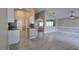 Open-concept living room and kitchen with tile flooring and vaulted ceiling at 4151 Forest Island Dr, Orlando, FL 32826