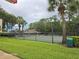Community tennis courts surrounded by lush landscaping and green lawns at 4151 Forest Island Dr, Orlando, FL 32826