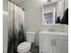 Bathroom with a shower-tub combo and a single sink vanity, complemented by soft, neutral wall color at 4300 Hector Ct # 7, Orlando, FL 32822