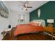 Comfortable bedroom featuring hardwood floors, stylish ceiling fan and modern decor at 4300 Hector Ct # 7, Orlando, FL 32822