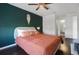 Comfortable bedroom featuring hardwood floors, stylish ceiling fan and modern decor at 4300 Hector Ct # 7, Orlando, FL 32822
