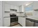 Bright kitchen with white cabinetry, stainless steel appliances, and modern countertops at 4300 Hector Ct # 7, Orlando, FL 32822