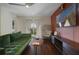 Comfortable living room with modern decor, sleek entertainment center, and plush green sofa at 4300 Hector Ct # 7, Orlando, FL 32822