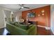 Bright living room with sliding doors to the balcony and a modern entertainment setup at 4300 Hector Ct # 7, Orlando, FL 32822