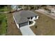 Aerial view of a home with a gray roof and a driveway at 4470 Frances Ave, Sanford, FL 32773