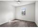 Bright bedroom features wood-look floors, neutral walls, and a ceiling fan at 4470 Frances Ave, Sanford, FL 32773