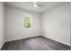 Cozy bedroom with a ceiling fan and large window overlooking the yard at 4470 Frances Ave, Sanford, FL 32773