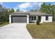 Charming single-story home featuring a two-car garage and newly landscaped front yard at 4470 Frances Ave, Sanford, FL 32773