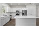 Beautiful kitchen with stainless appliances, granite counters, a central island, and open floorplan at 4470 Frances Ave, Sanford, FL 32773