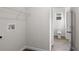 Functional laundry room with washer/dryer hookups and wire shelving at 4470 Frances Ave, Sanford, FL 32773