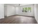 Bright and airy living room featuring vinyl floors, ceiling fan, and ample natural light at 4470 Frances Ave, Sanford, FL 32773